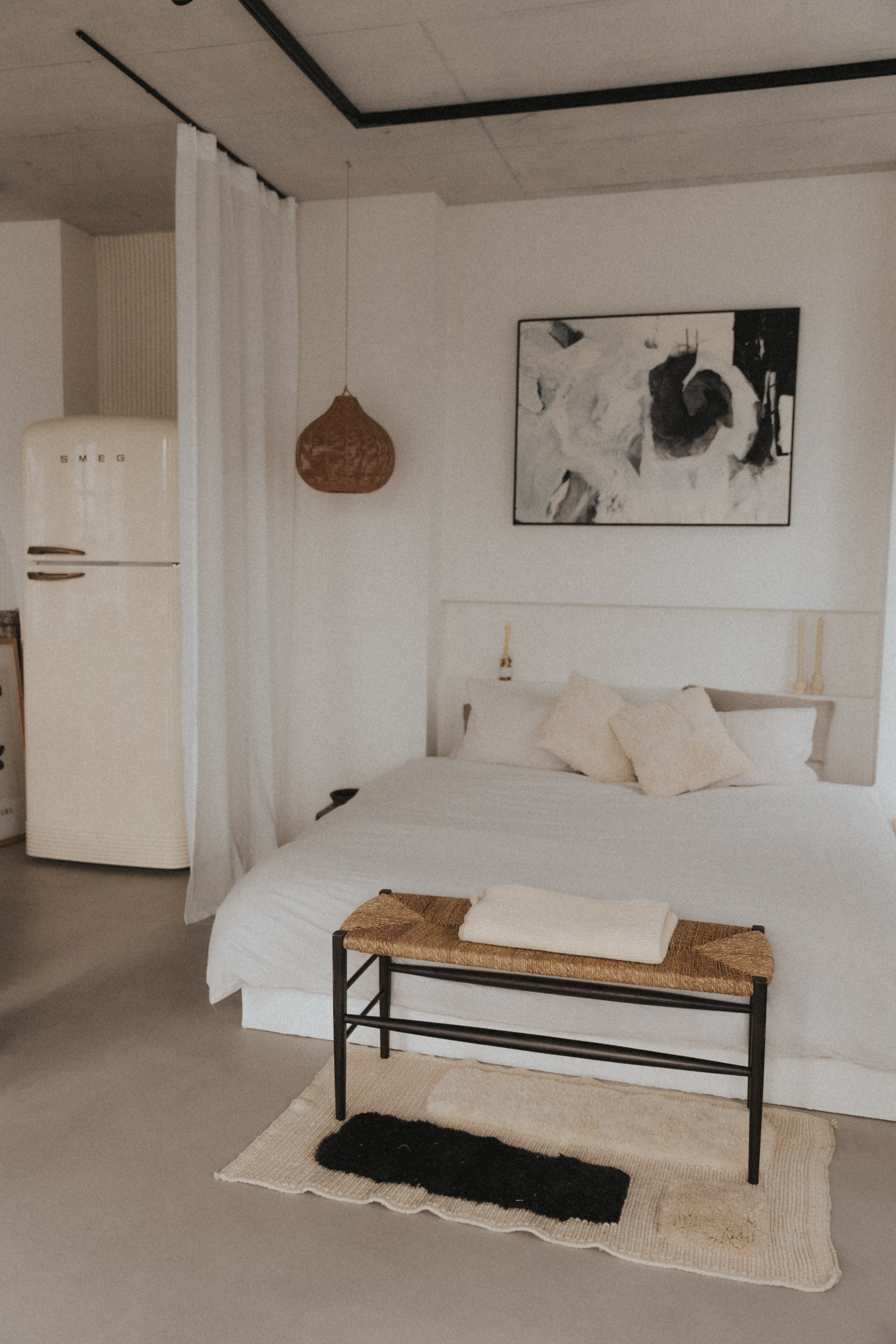 WHITE BED WITH WHITE FRIDGE