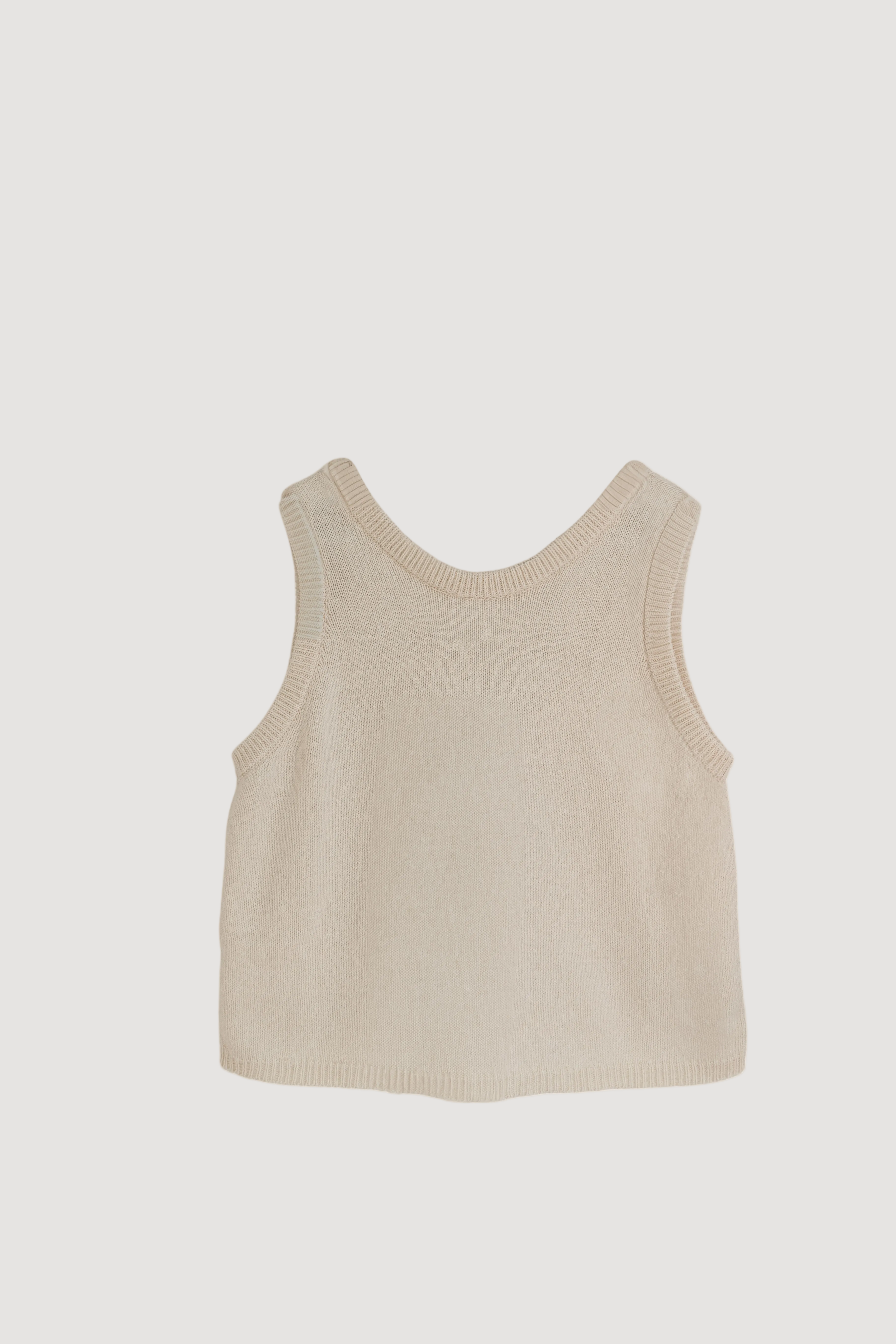 A beige knit tank top displayed against a neutral background.