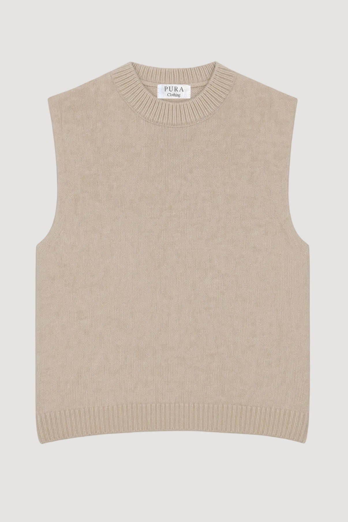Beige knitted vest with 'Puma' branding on a white background
