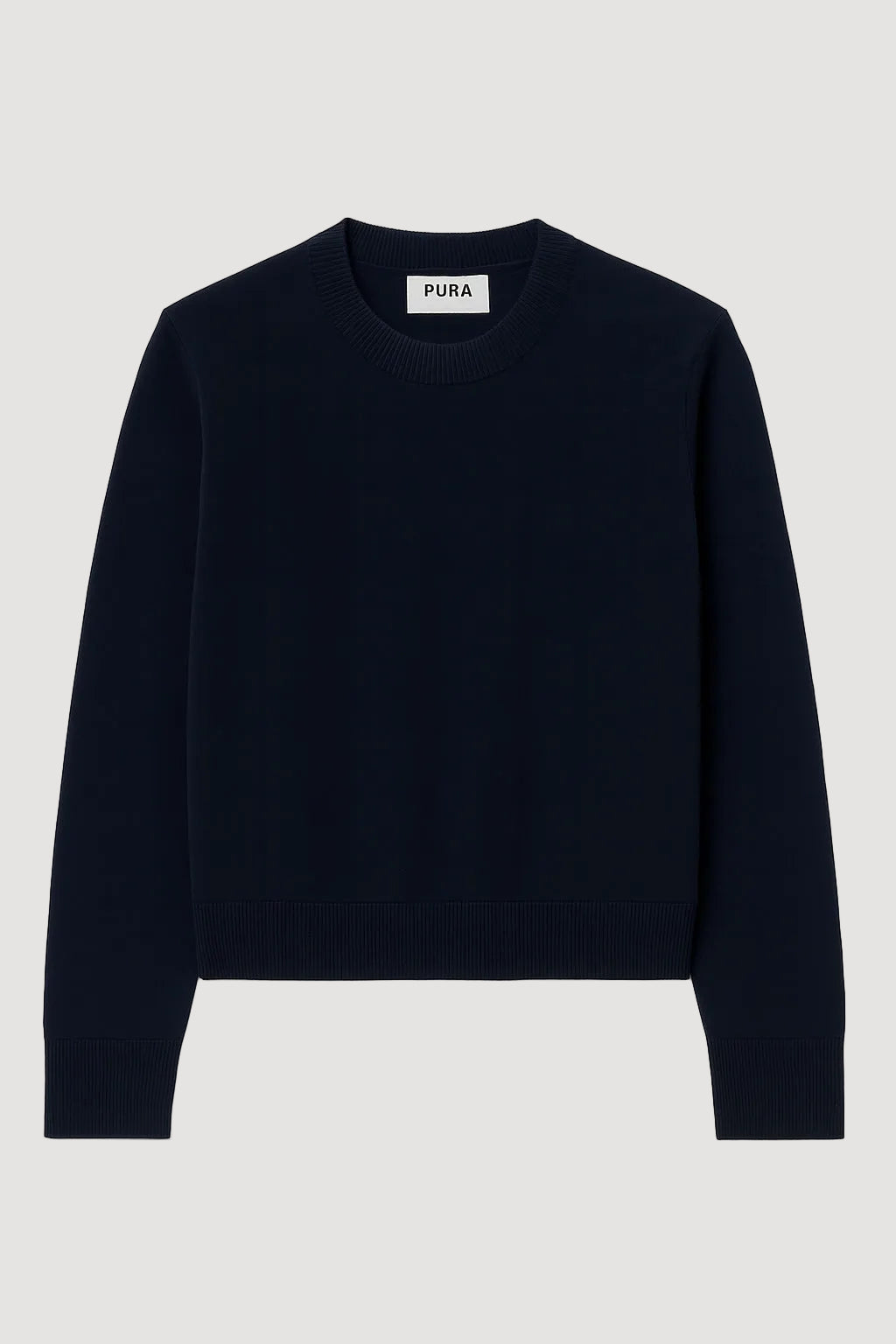 navy sweater with 'Pura' label on a white background