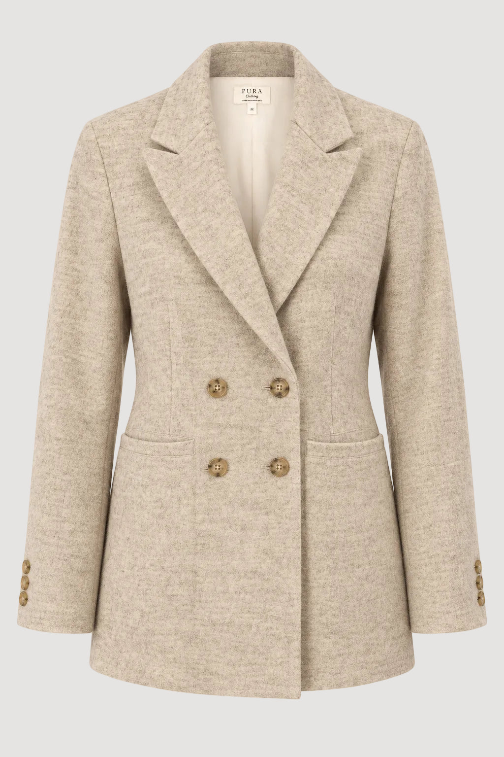 A beige double-breasted blazer with a textured wool-like finish, featuring notched lapels, four decorative gold-tone buttons, and flap pockets, shown on a plain white background.