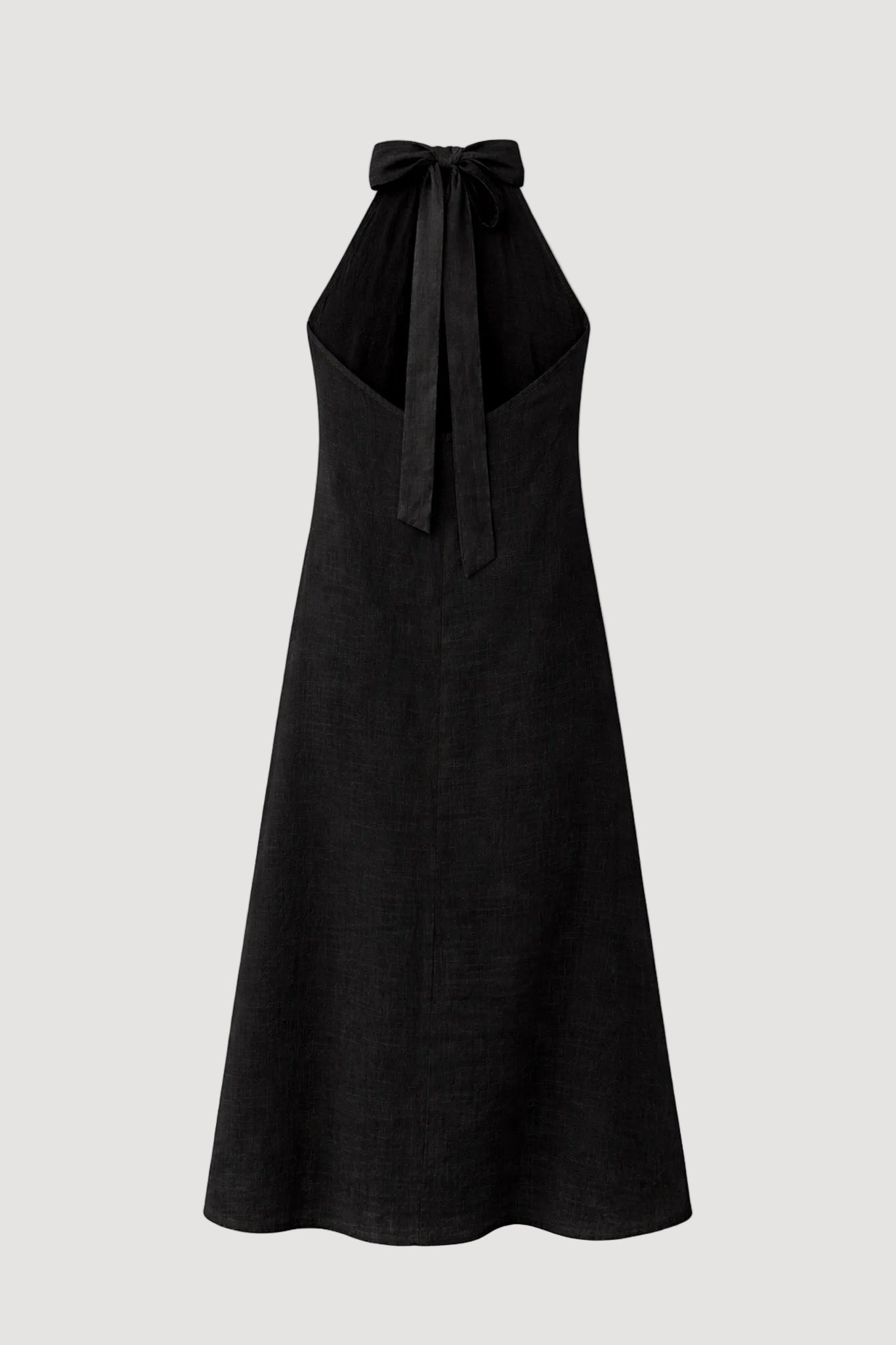 Black halter neck dress with bow detail on a white background