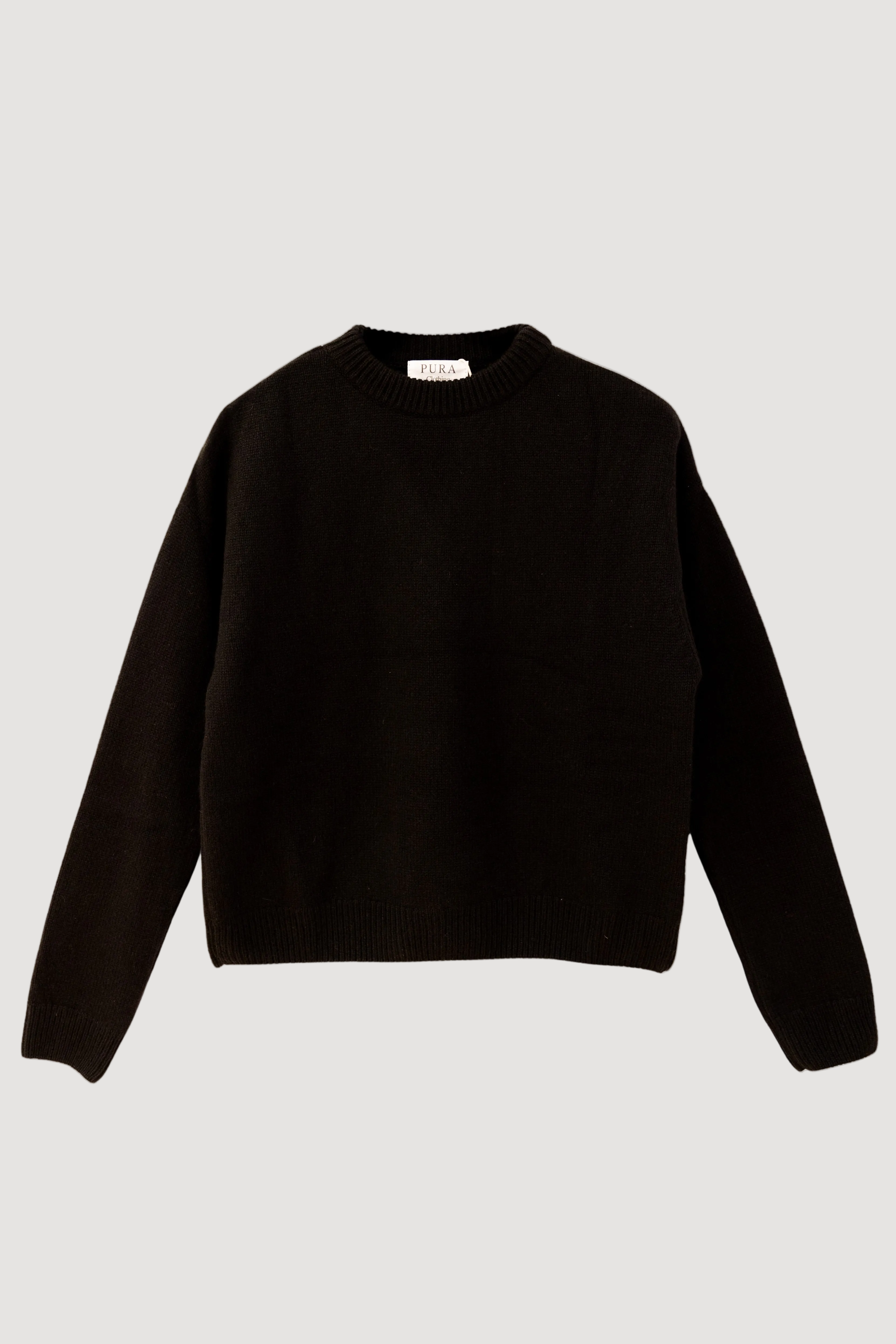 A black crewneck sweater made from a cashmere and silk mix fabric.