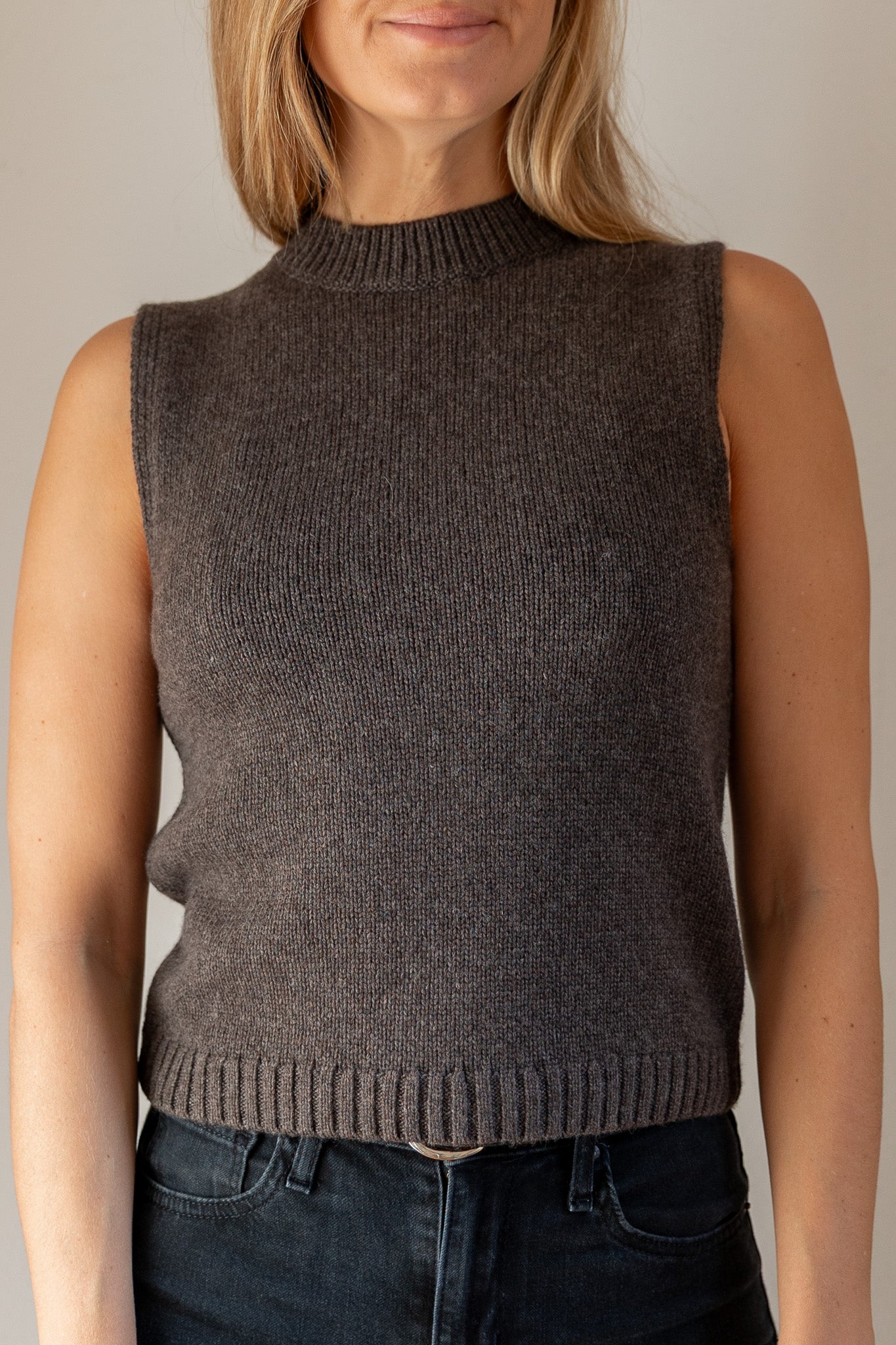 woman wearing brown mock neck tank cashmere from pura clothing