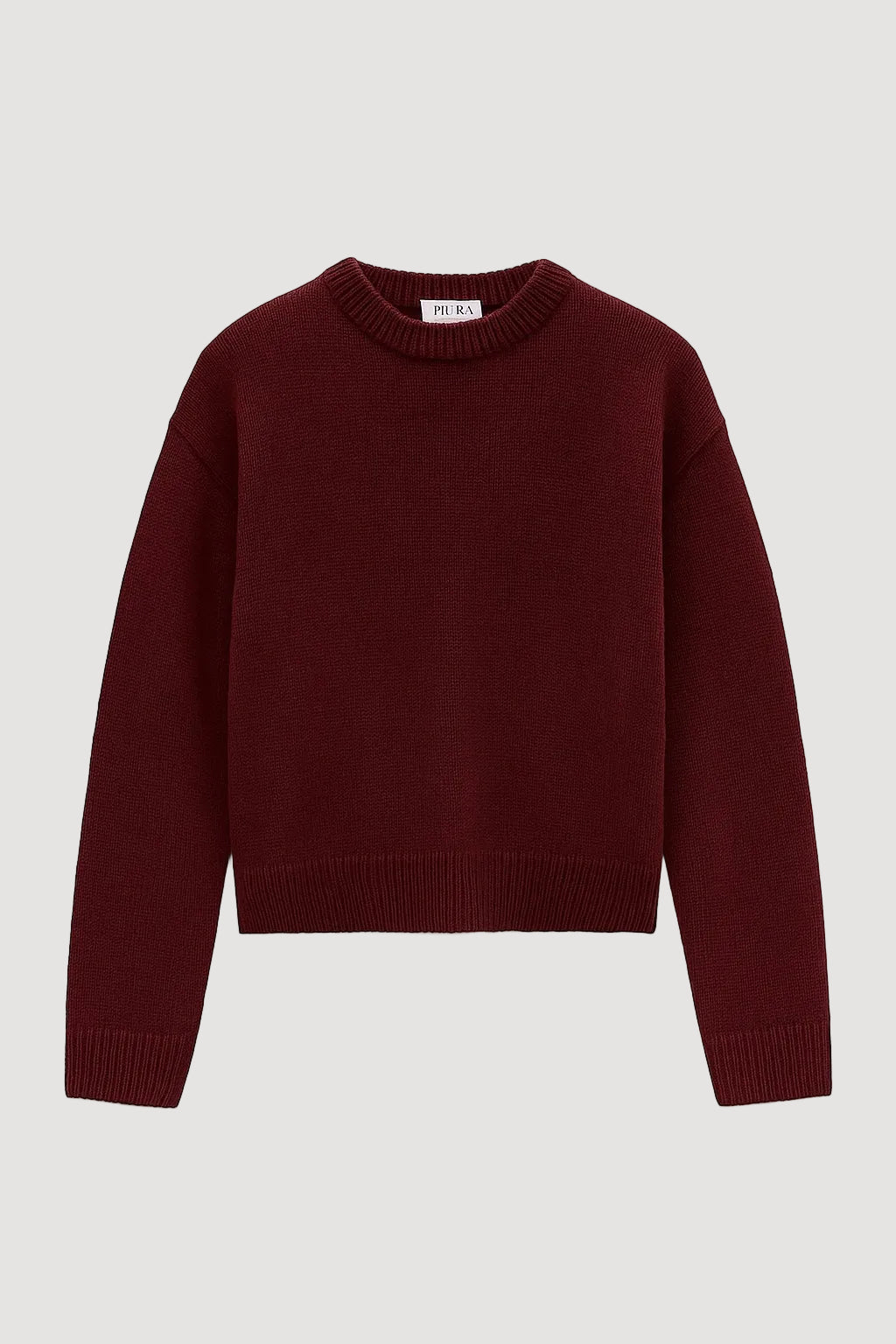 Burgundy sweater on a white background