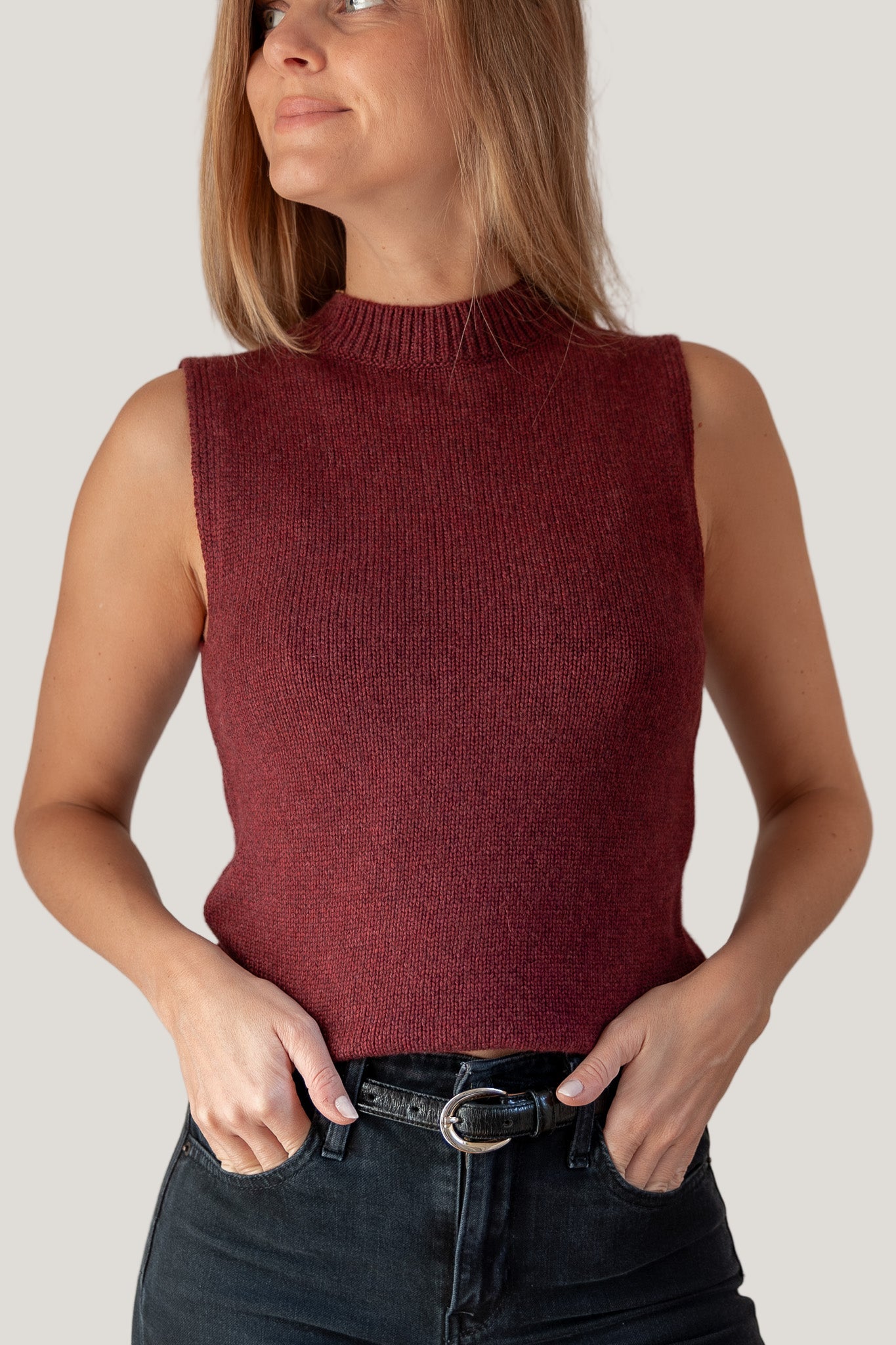 woman wearing burgundy mock neck tank