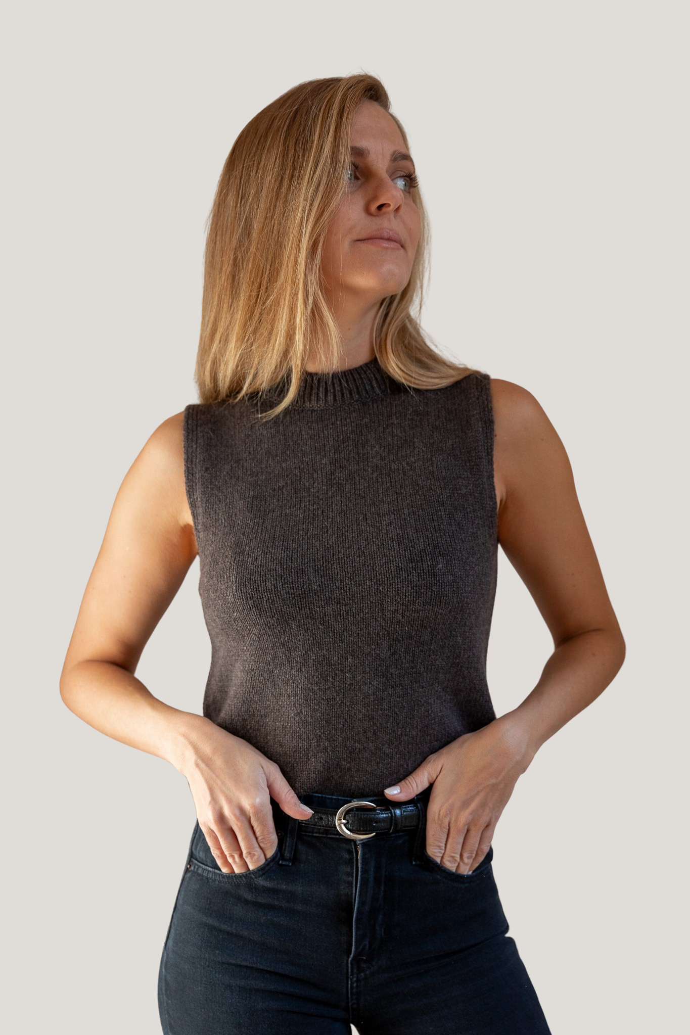 woman wearing brown mock neck tank cashmere from pura clothing