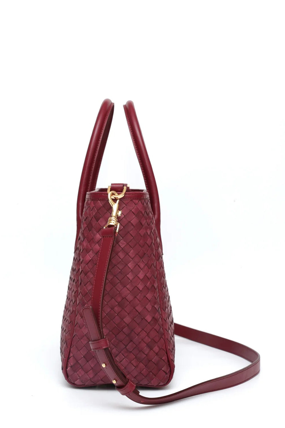 Red woven handbag with a gold clasp on a white background