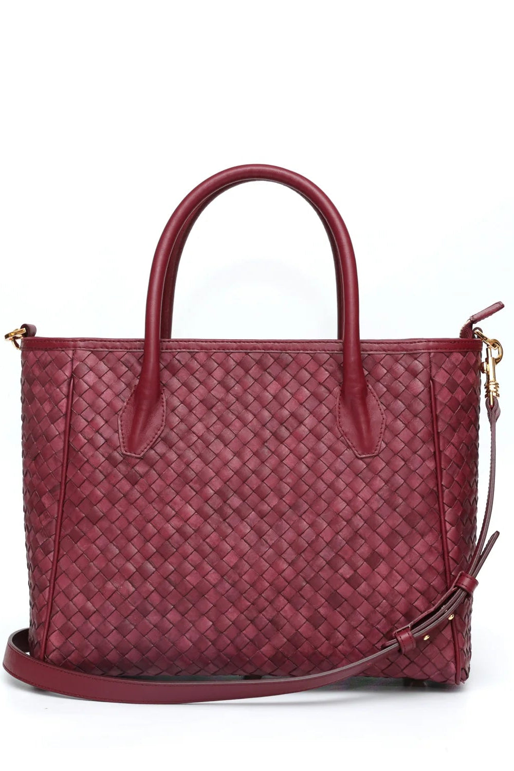 Red woven handbag with a strap on a white background