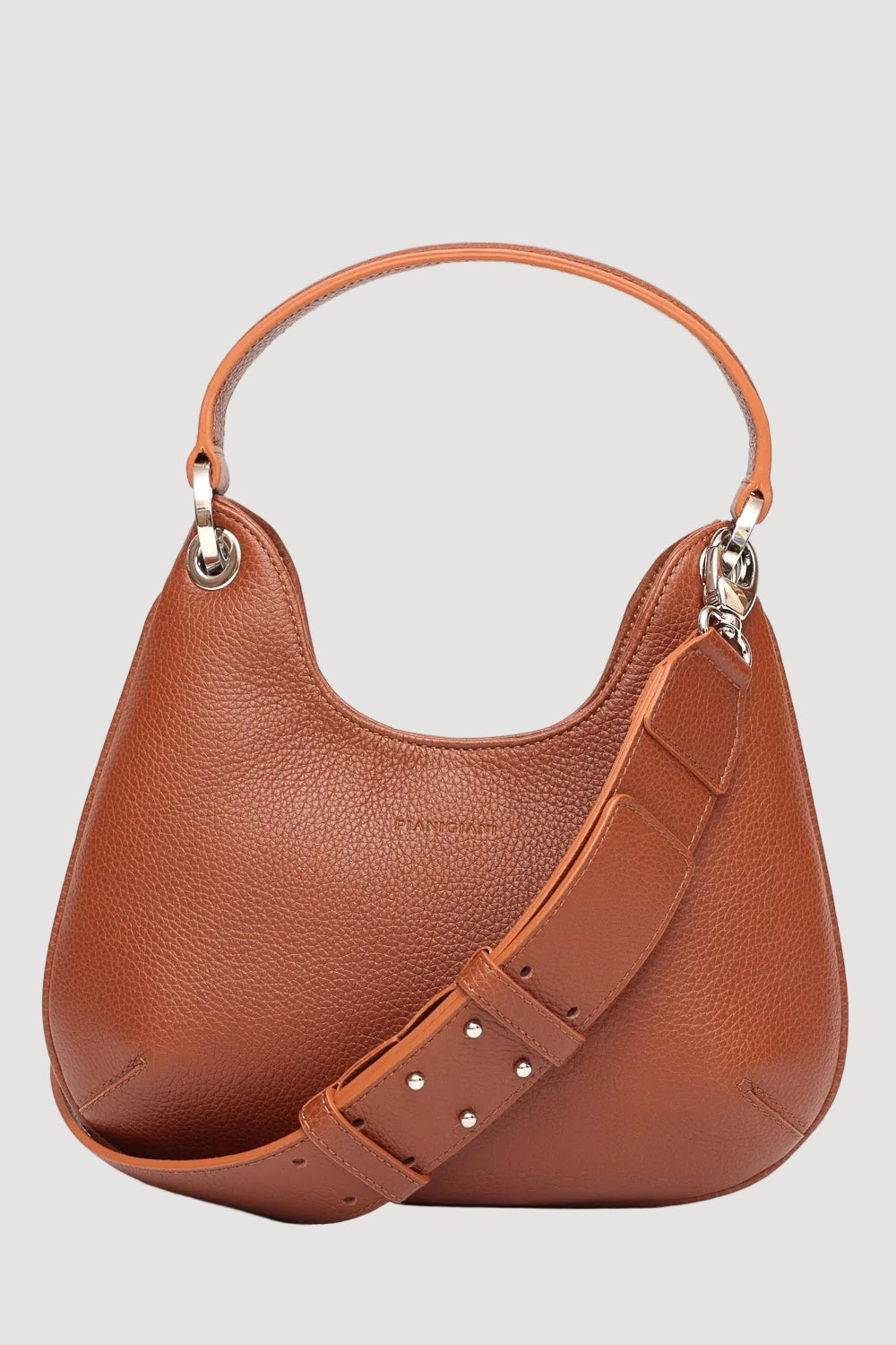 Brown leather handbag with a shoulder strap on a white background