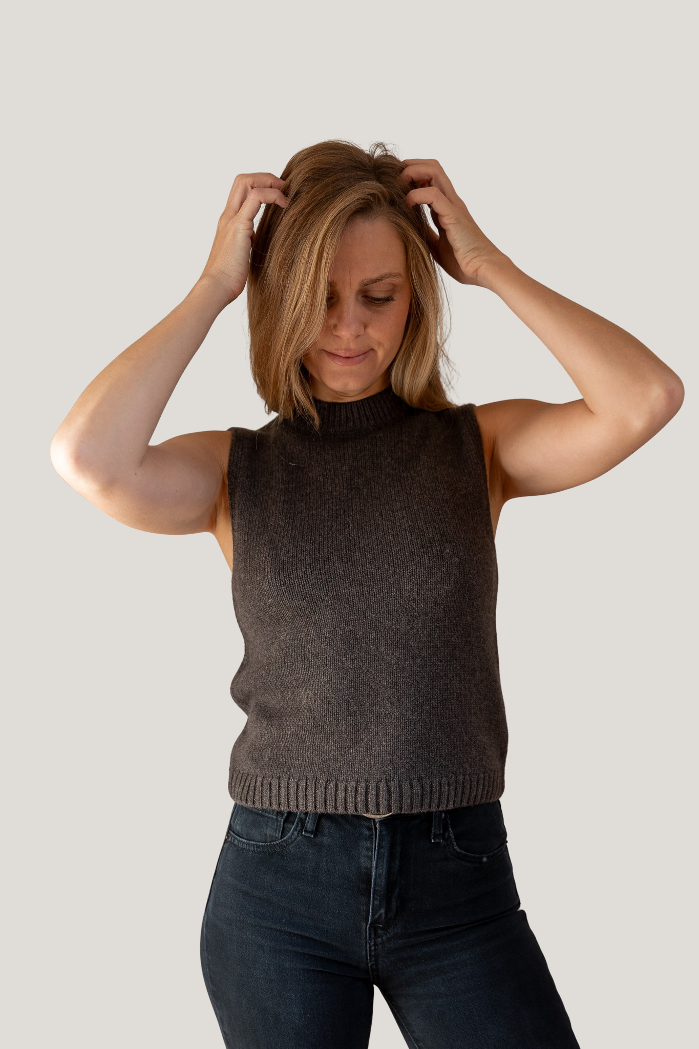 woman wearing brown mock neck tank cashmere from pura clothing