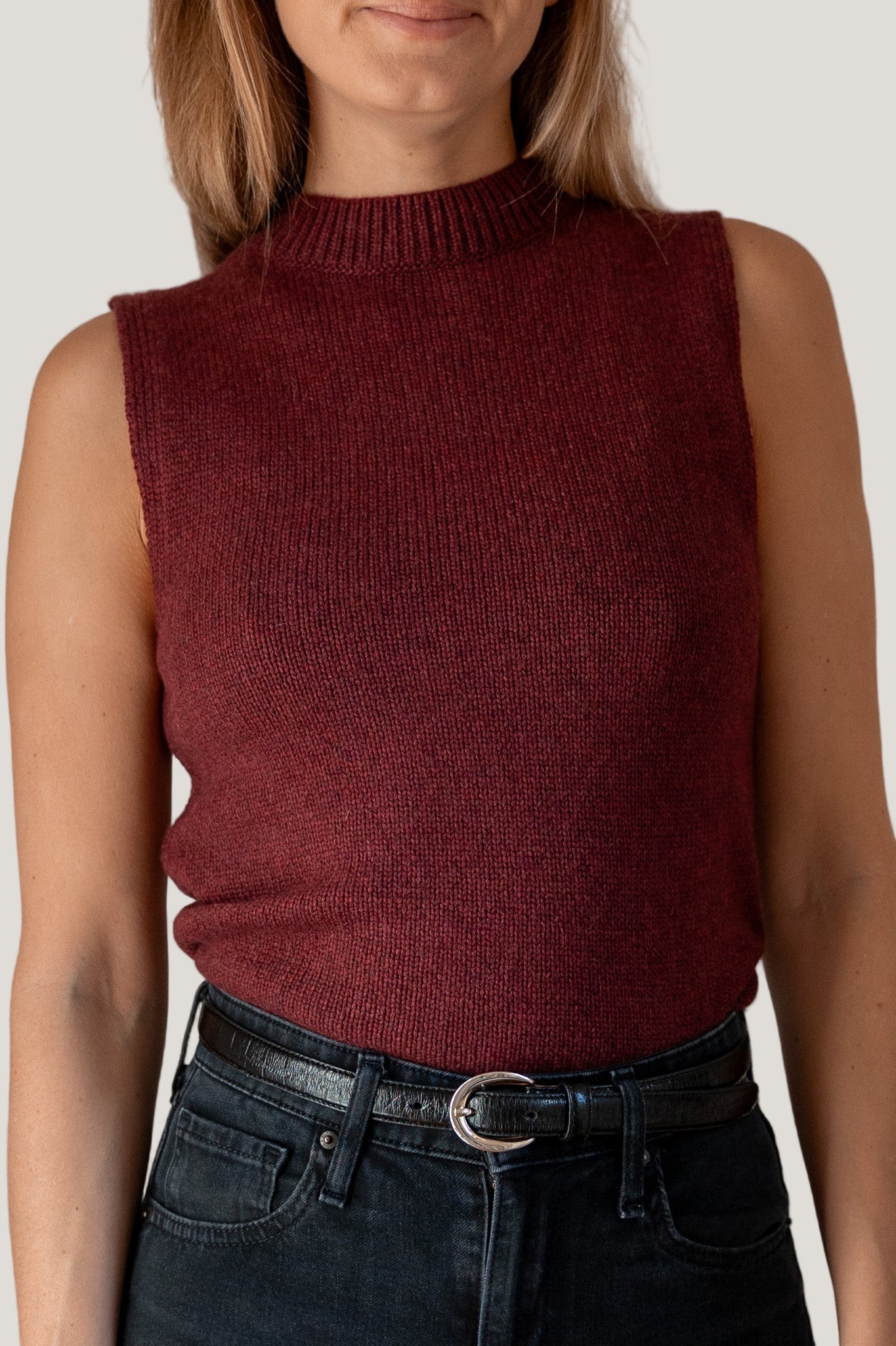 woman wearing burgundy mock neck tank