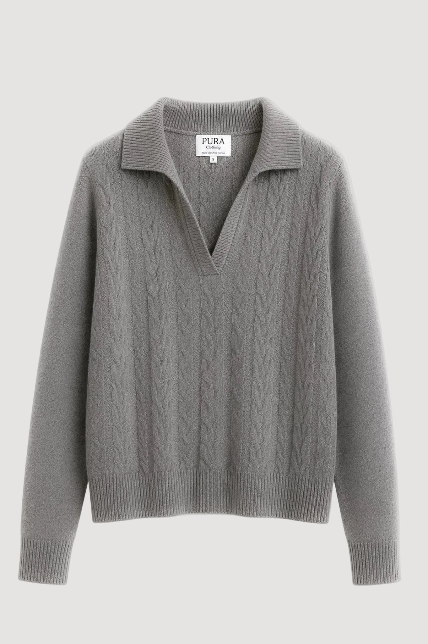 A gray cable-knit sweater with a polo-style collar, long sleeves, and ribbed cuffs and hem, shown flat against a white background. The brand label reads 'PURA CLOTHING'.