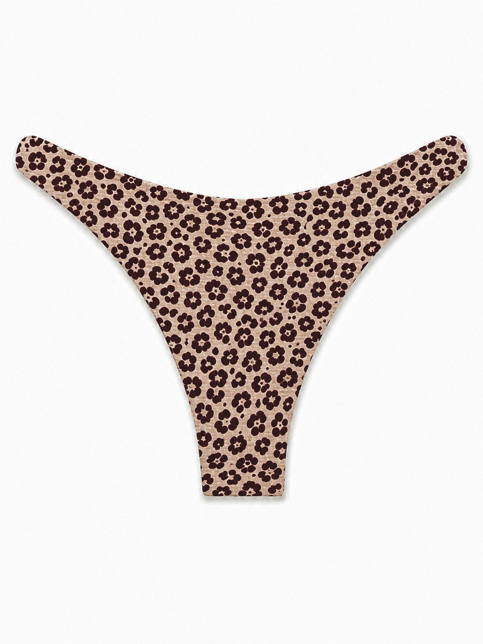 Thong-style bikini bottom with an allover small floral LEO print in dark brown on a warm beige background, shown flat against a plain white background.