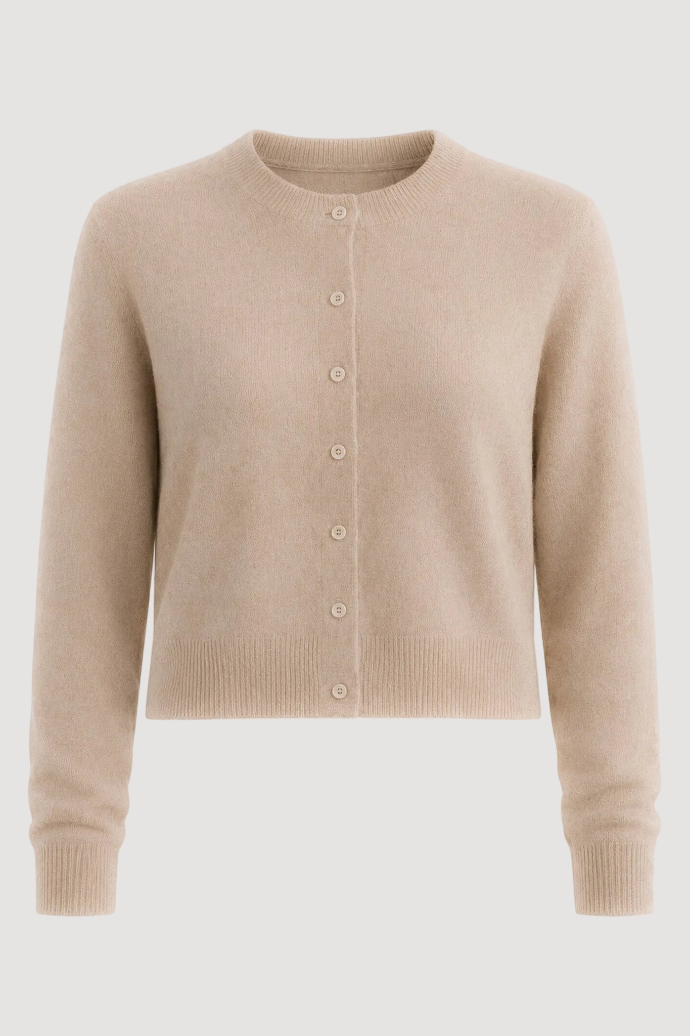 A cropped, long-sleeve knit cardigan sweater in a light beige color, featuring a button-up front with small buttons and ribbed cuffs and hem, shown against a plain white background.