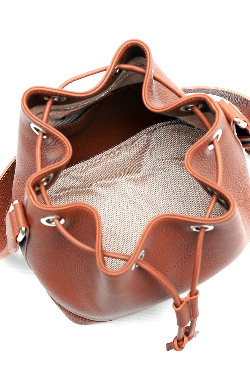 Brown leather bucket bag on a white background