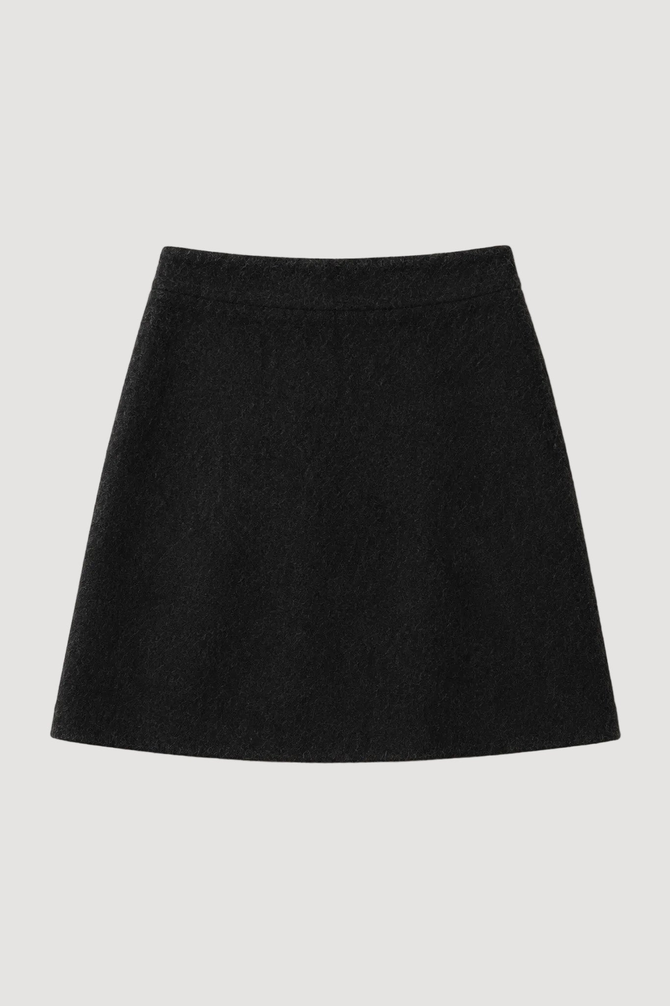 A black A-line mini skirt made of textured wool-like fabric, laid flat against a light beige background.